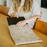 Woman putting laptop into offspring laptop case